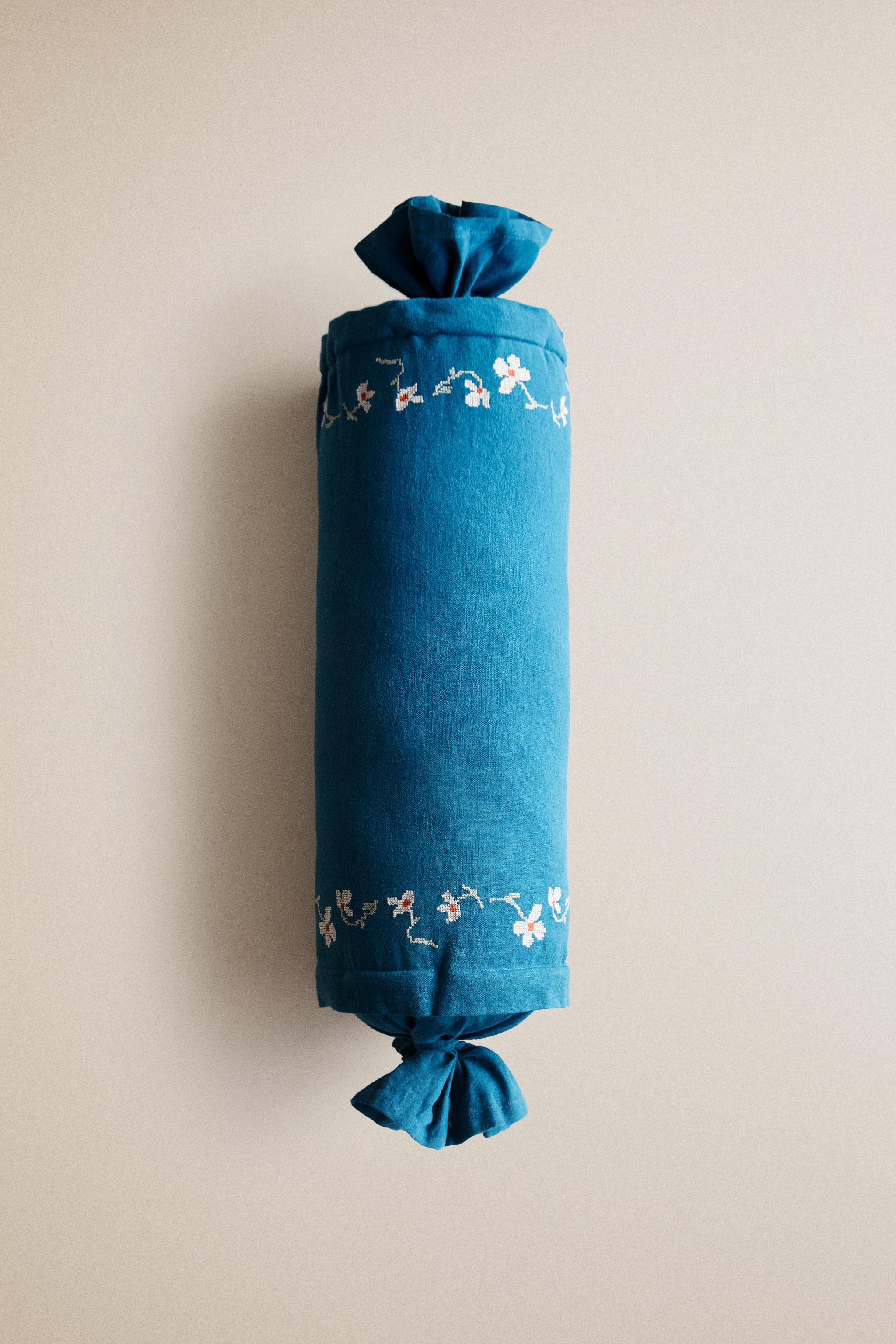 EMBROIDERED FLORAL BOLSTER PILLOW
